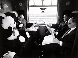 Images Dated 1st May 1970: In best British fashion, fellow passengers ignore Peter the panda in a carriage on board