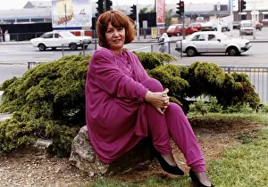 Beverley Phillips actress sitting on rock A©Mirrorpix Beverley Phillips actress sitting on rock A©Mirrorpix