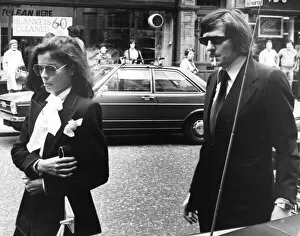 Bianca Jagger and John Paul Getty II walking in London street - June 1976
