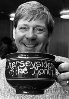 Images Dated 19th April 1985: Billy Butler raises a smile and a cup of tea for the Merseyside of the Month competition