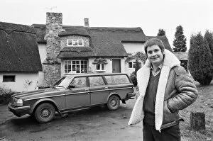 Images Dated 18th November 1982: Black Sabbath singer Ozzy Osbourne pictured outside his new house, beside his Volvo car