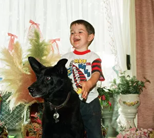 Images Dated 17th June 1993: Blackie the dog is pictured with a small boy. 17th June 1993