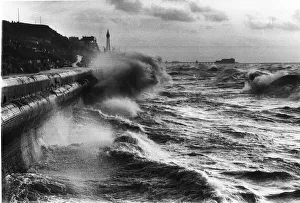 Blackpool beach during a storm with Blackpool Tower in background Sea crashing up Blackpool beach during a storm with Blackpool Tower in background Sea crashing up