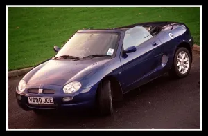Blue MG Car November 1999 convertible hood down Blue MG Car November 1999 convertible hood down