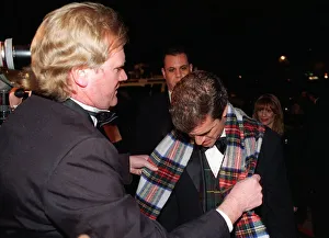 Bob Shields Daily Record journalist gives his tartan scarf to Mel Gibson after the Oscar Bob Shields Daily Record journalist gives his tartan scarf to Mel Gibson after the Oscar