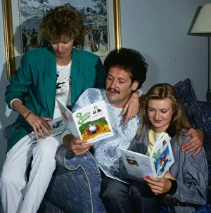 Bobby Ball and family at home with books September 1988