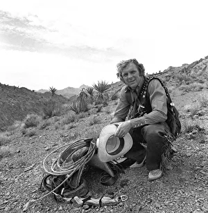 Images Dated 6th June 1971: Bobby Moore dressed as cowboy when West Ham team were on close season tour of America