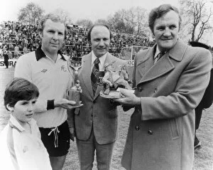 Images Dated 7th May 1977: Bobby Moore former England captain seen here with the Jules Rimet trophy