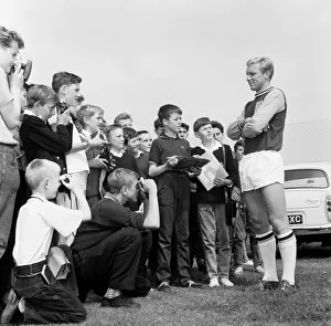 Bobby Moore West Ham United Defender, poses for young fans during a training session open Bobby Moore West Ham United Defender, poses for young fans during a training session open