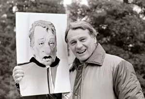 Images Dated 22nd February 1985: Bobby Robson England manager pictured with a photograph of his spitting image puppet
