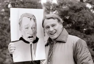 Bobby Robson England manager pictured with a photograph of his spitting image puppet Bobby Robson England manager pictured with a photograph of his spitting image puppet