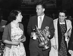 Bolton Skipper, Nat Lofthouse is swinging the cup as he is chased along the platform by Bolton Skipper, Nat Lofthouse is swinging the cup as he is chased along the platform by