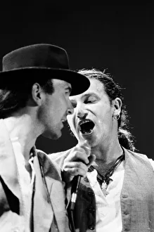 Bono onstage singing with The Edge during U2's concert in Cork Bono onstage singing with The Edge during U2's concert in Cork