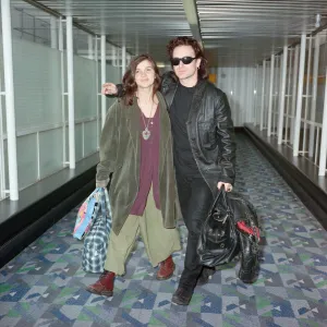 Bono of rock group U2 and his wife Ali pictured at London Airport. 10th October 1991 Bono of rock group U2 and his wife Ali pictured at London Airport. 10th October 1991