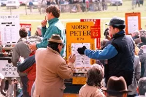 Images Dated 2nd April 1995: A bookie changing the odds at the racetrack in April 1995