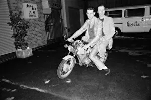 The Boomtown Rats in Tokyo. Pictured, singer Bob Geldof and Garry Roberts on a motorbike