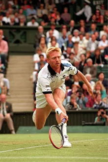 BORIS BECKER IN ACTION PLAYING ON COURT AT THE 1993 WIMBLEDON TENNIS TOURNAMENT BORIS BECKER IN ACTION PLAYING ON COURT AT THE 1993 WIMBLEDON TENNIS TOURNAMENT
