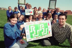 Former Boro player Bernie Slaven with Katie McCormick and class at St Dominic' Former Boro player Bernie Slaven with Katie McCormick and class at St Dominic'