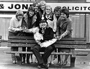 Images Dated 10th December 1982: Bouquets for Huyton policeman David Henderson from local shop keepers