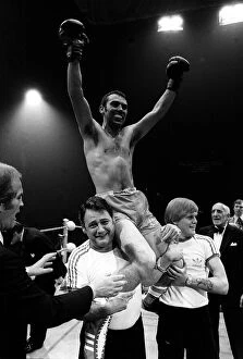 Boxer Alan Minter after win against Gratien Tonna 1978 sits on shoulders of trainer