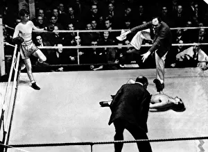 Boxer Benny Lynch in ring with fallen opponent who is being counted out Boxer Benny Lynch in ring with fallen opponent who is being counted out