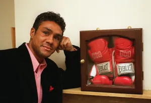 Boxer Kevin Lveshing at home in Westerham standing in front of cased boxers gloves Boxer Kevin Lveshing at home in Westerham standing in front of cased boxers gloves
