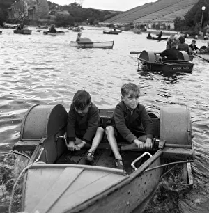 Two boys in a boat, at the boating lake at Northstead Manor Gardens in Scarborough Two boys in a boat, at the boating lake at Northstead Manor Gardens in Scarborough