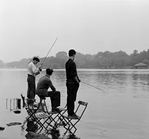 Boys fishing on the Serpentine in London's Hyde Park. 8th August 1957 Boys fishing on the Serpentine in London's Hyde Park. 8th August 1957