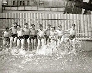 Boys kicking up water in swimming pool, summer 1951 Boys kicking up water in swimming pool, summer 1951