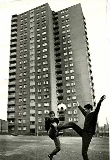 Images Dated 30th August 2012: Boys playing football high rise flats Royston Glasgow 1966 Garry mcDonald