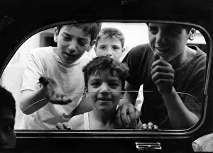 Boys from the slum areas of Naples in southern Italy beg for money through car windows Boys from the slum areas of Naples in southern Italy beg for money through car windows