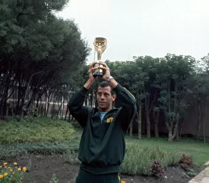 Images Dated 22nd June 1970: Brazil captain Carlos Alberto holds aloft the Jules Rimet World cup trophy following