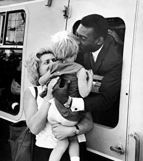 Brazilian football star Pele gives a parting kiss to three year old girl Virginia Ferrari Brazilian football star Pele gives a parting kiss to three year old girl Virginia Ferrari