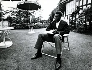 Brazilian football star Pele relaxes in an English country garden at the Brazilian team Brazilian football star Pele relaxes in an English country garden at the Brazilian team