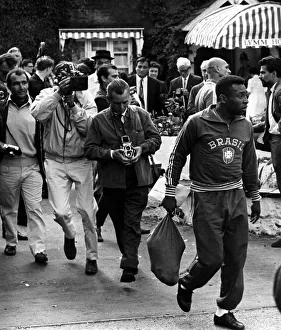Brazilian football star Pele surrounded by photographers Brazilian football star Pele surrounded by photographers