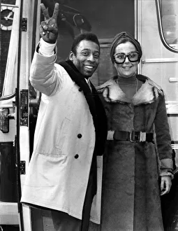 Brazilian football star Pele with his wife Rosa as he arrives in London to play football Brazilian football star Pele with his wife Rosa as he arrives in London to play football