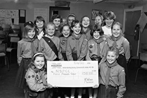 Images Dated 15th October 1990: Breaking their silence to present 50 to the NSPCC were these Girl Guides