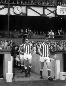 Supporters And Spectators Gallery: Brian Clough makes his return debut for Sunderland at Roker Park as young fans pat him