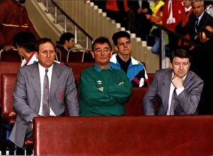 Brian Clough, Nottingham Forest manager, sitting on bench with club officials during FA