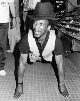 Images Dated 15th May 1988: Brinsley from Aswad took part in a charity event, filling dustbins with albums to raise