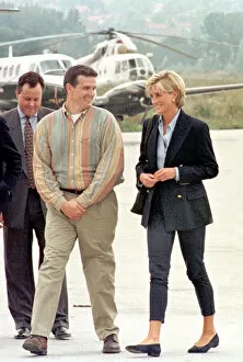 Images Dated 8th August 1997: Britains Diana, Princess of Wales, right, meets mine victim Ken Rutherford center
