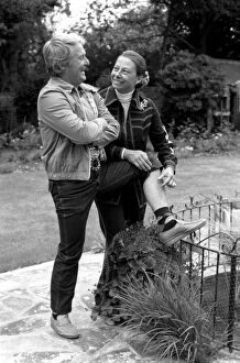 Images Dated 9th June 1980: British comedian Ernie Wise showing off his fat hairy legs to his wife. June 1980