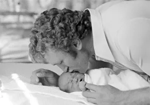 Former British European Heavyweight champion boxer Joe Bugner kisses his new born baby Former British European Heavyweight champion boxer Joe Bugner kisses his new born baby