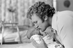 Former British European Heavyweight champion boxer Joe Bugner kisses his new born baby Former British European Heavyweight champion boxer Joe Bugner kisses his new born baby