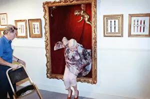 Images Dated 21st July 1992: British fashion designer Vivienne Westwood, posing as an oil painting and jumping out