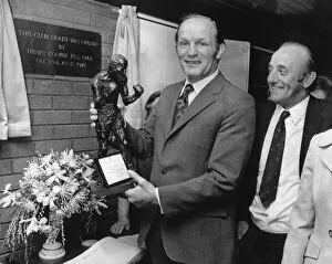 Images Dated 29th April 1972: Former British Heavyweight champion boxer Henry Cooper holds a bronze statue of himself