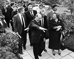 Images Dated 3rd October 1984: British Prime Minister Margaret Thatcher is led by Sir Leslie Young through the British