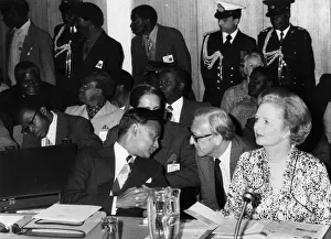 British Prime Minister Margaret Thatcher with Lord Carrington talking to Joshua Nkomo at British Prime Minister Margaret Thatcher with Lord Carrington talking to Joshua Nkomo at