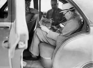 00363 Gallery: British Prime Minister Winston Churchill with American officers studying aerial