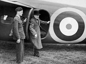 00363 Gallery: British Prime minister Winston Churchill leaves his aeroplane for a visit to a defence